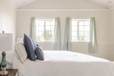 a white bedroom with a bed and two windows at Willow Nest - Sequoia And Kings Canyon Villa - Luxury In Nature in Hoffman Point