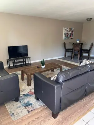 a living room with a couch and a coffee table at Serene 2bed 1bath condo with parking in Fresno