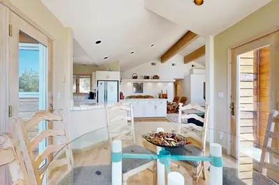 a kitchen and living room with a table and chairs at Livin' Lake Life in Incline Village