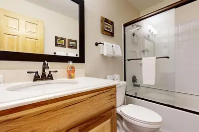 a bathroom with a sink and a toilet and a shower at Alpine Serenity in Incline Village