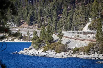 a view of a river with a bridge next to a mountain at McCloud 176 in Incline Village