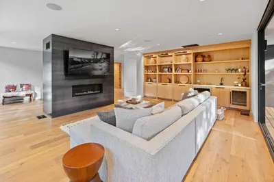 a living room with a couch and a fireplace at Creekside Retreat - Near Palisades Tahoe in Olympic Valley