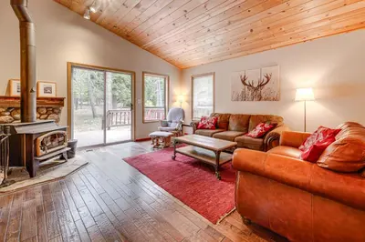a living room with a couch and a fireplace at Home with Deck and Access to Tahoe Donner Amenities! in Truckee