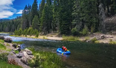 a person in a raft on a river at 2BR Mins to Alpine Base Area Palisades! in Alpine Meadows