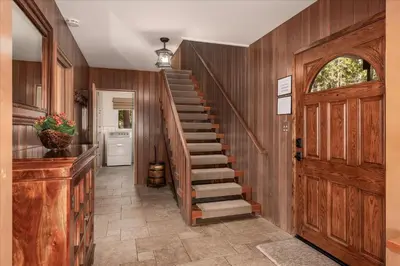 a hallway with a wooden staircase and a door at River's Edge w/ BBQ, Wifi, Firepit in North Wawona
