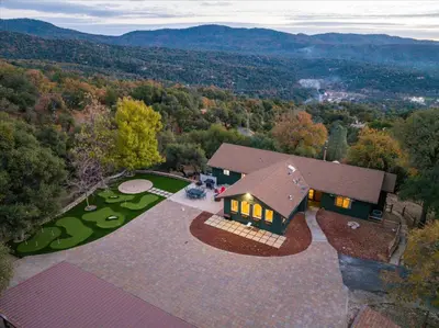 an overhead view of a house with a view of the mountains at Vista Haven with stunning views/hot tub/mini golf in Oakhurst