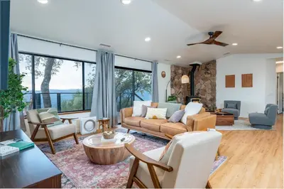a living room with a couch and chairs at Vista Haven with stunning views/hot tub/mini golf in Oakhurst