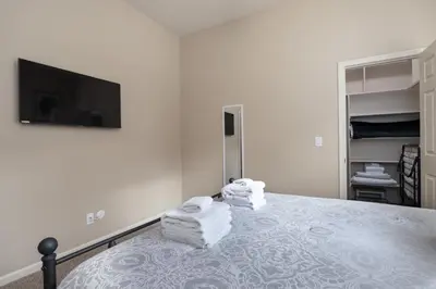 a bedroom with a bed with towels on it at Mountain View House with hot tub, putting green, stunning views in Oakhurst