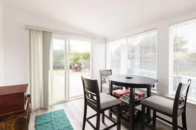 a dining room with a table and chairs at Homey Pool Fun Gameroom Sunnyside Retreat in Fresno