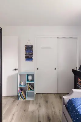 a bedroom with white walls and white doors at Homey Pool Fun Gameroom Sunnyside Retreat in Fresno