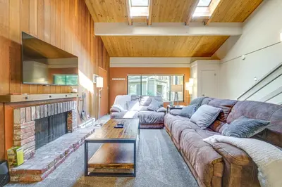 a living room with a couch and a fireplace at 2 Mi to Beach Inviting Incline Village Escape in Incline Village