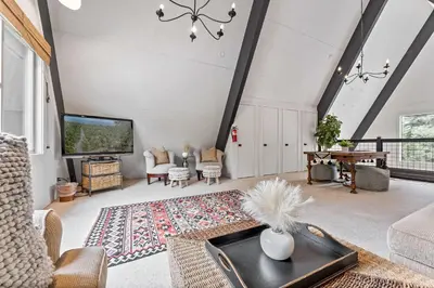 an open living room with a large ceiling at 5BR A Frame Near Patton Beach with 2 Decks in Carnelian Bay
