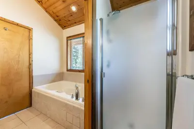 a bathroom with a shower and a bath tub at Horizon at Tahoe Donner w Private Hot Tub and Mountain Views in Truckee