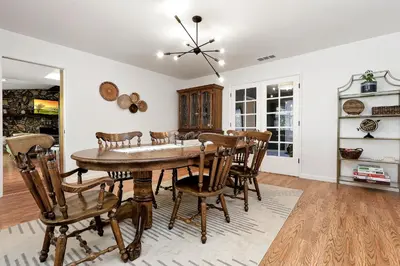 a dining room with a table and chairs at Home in the Pines - Apple Hill - Dog Friendly - Snow Nearby in Pollock Pines