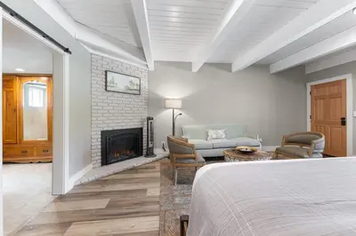 a bedroom with a bed and a fireplace at Big Pine Suite CN Lodge R#1 in Ponderosa