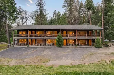 a large house with a lot of windows at Camp Nelson Lodge Room 2 in Ponderosa