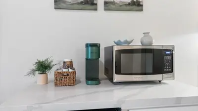 a microwave oven sitting on a counter next to at Suite Meadow @CN Lodge# 7 in Ponderosa