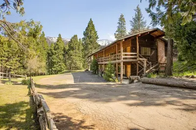 a log cabin with a road in front of it at Timberline Retreat CN Lodge #3 in Ponderosa