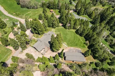 an overhead view of a house with trees at Camp Nelson Lodge Room 9 in Ponderosa
