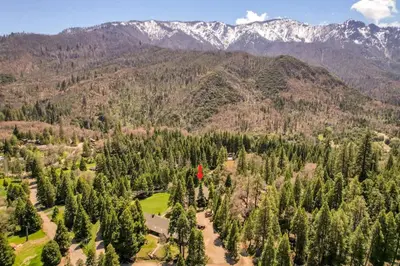 an aerial view of a forest of trees and mountains at Camp Nelson Lodge Room 10 in Ponderosa
