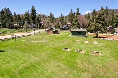 a park with benches in the middle of a field at Camp Nelson Lodge Room 10 in Ponderosa