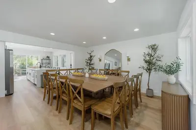 a kitchen and dining room with a table and chairs at Lakefront Cottage at Lakewood in Auburn