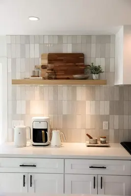 a kitchen with white cabinets and a counter top at Treehouse Overlook at Lakewood in Auburn