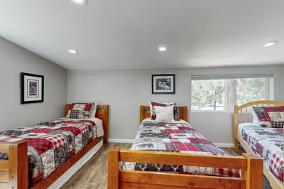 a bedroom with two beds and a window at Summit Sanctuary in Stateline