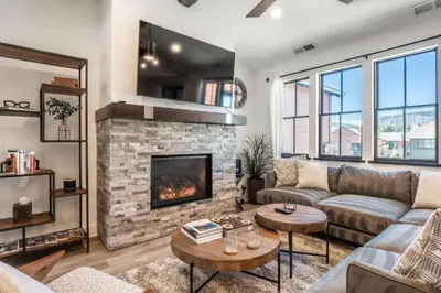 a living room with a couch and a fireplace at Creekhouse 1353 in Mammoth Lakes