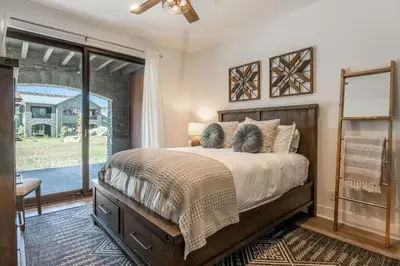 a bedroom with a large bed and a window at Creekhouse 1353 in Mammoth Lakes