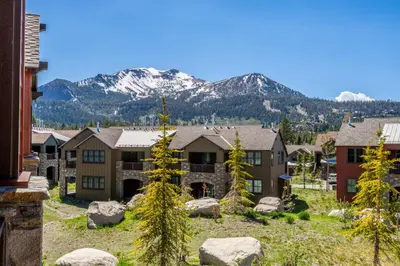 a row of houses with a mountain in the background at Creekhouse 1353 in Mammoth Lakes