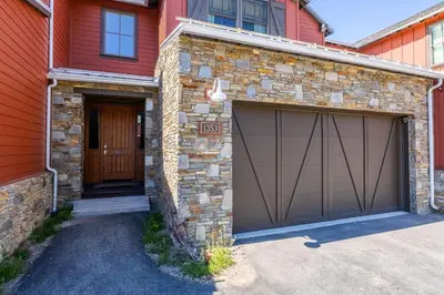 a house with a garage with at Creekhouse 1353 in Mammoth Lakes
