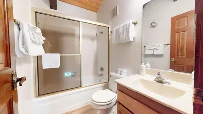 a bathroom with a toilet and a sink and a shower at Sunrise #33 condo in Mammoth Lakes