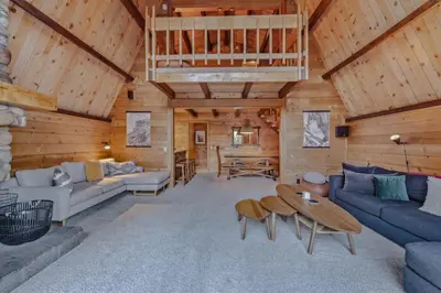 a living room with a couch and a table at 3BR with Sauna & Lake Views, 2 miles to Beach in Tahoe City