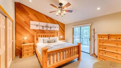 a bedroom with a bed and a ceiling fan at Paige Meadow by AvantStay Near Lake Tahoe City in Tahoe City