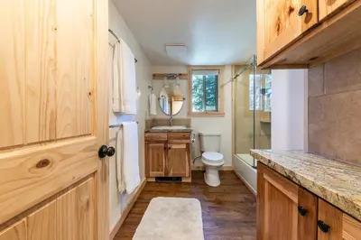 a bathroom with a toilet and a sink and a shower at 10th Mountain Home - 4BR Tahoe Donner w Hot Tub, HOA amenities! in Truckee