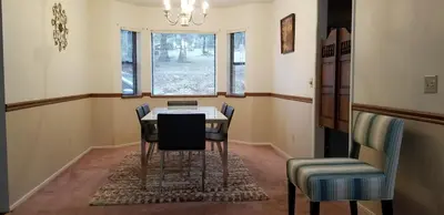 a dining room with a table and chairs at Starlink Mariposa Yosemite mountain retreat in Mariposa