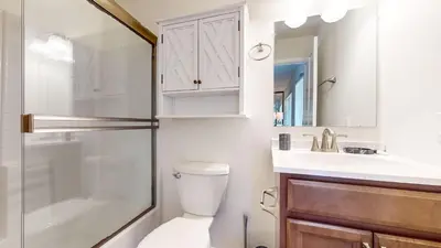 a bathroom with a toilet and a sink and a shower at Forest Creek #16 condo in Mammoth Lakes