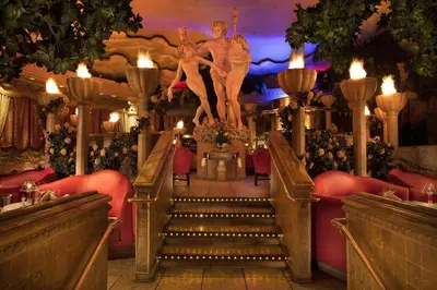 a set of stairs in a restaurant with a statue at Peppermill Resort Spa Casino in Reno