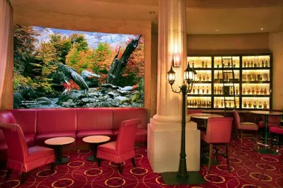 a restaurant with a red couch and a large window at Peppermill Resort Spa Casino in Reno