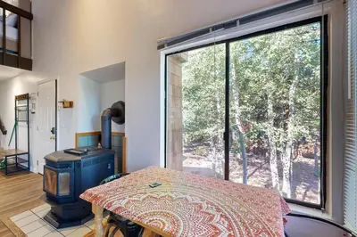 a room with a table and a large window at Pine in the Sky in Truckee