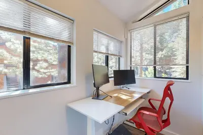 a office with a desk with a computer and a red chair at Pine in the Sky in Truckee