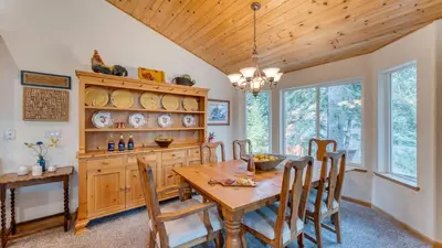 a dining room with a wooden table and chairs at Tahoe Vista by AvantStay Central Location Patio in Tahoe Vista