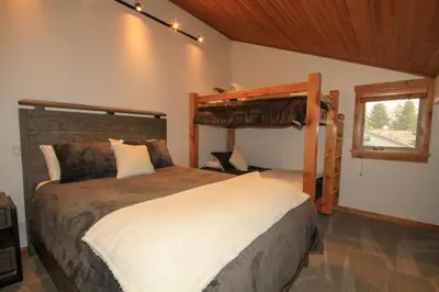 a bedroom with a bunk bed in a room at Tamarack 39 in Mammoth Lakes