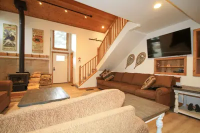a living room with a couch and a fireplace at Tamarack 39 in Mammoth Lakes