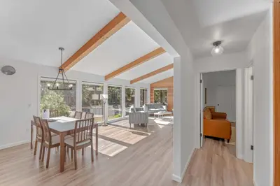 a dining room and living room with a table and chairs at Modern 3BR Carnelian Bay Retreat in Carnelian Bay