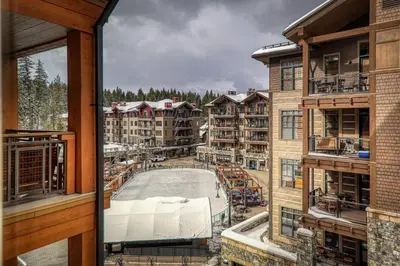 a view from the balcony of a resort with a pool at Big Horn Lodge 401 by East West Hospitality in Truckee
