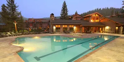 a large swimming pool in front of a house at Big Horn Lodge 403 by East West Hospitality in Truckee