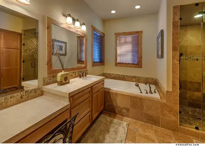 a bathroom with a tub and a sink and a shower at Caleb Drive 12802 by East West Hospitality in Truckee