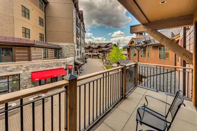 a balcony with a bench on a balcony at Catamount Lodge 204B by East West Hospitality in Truckee